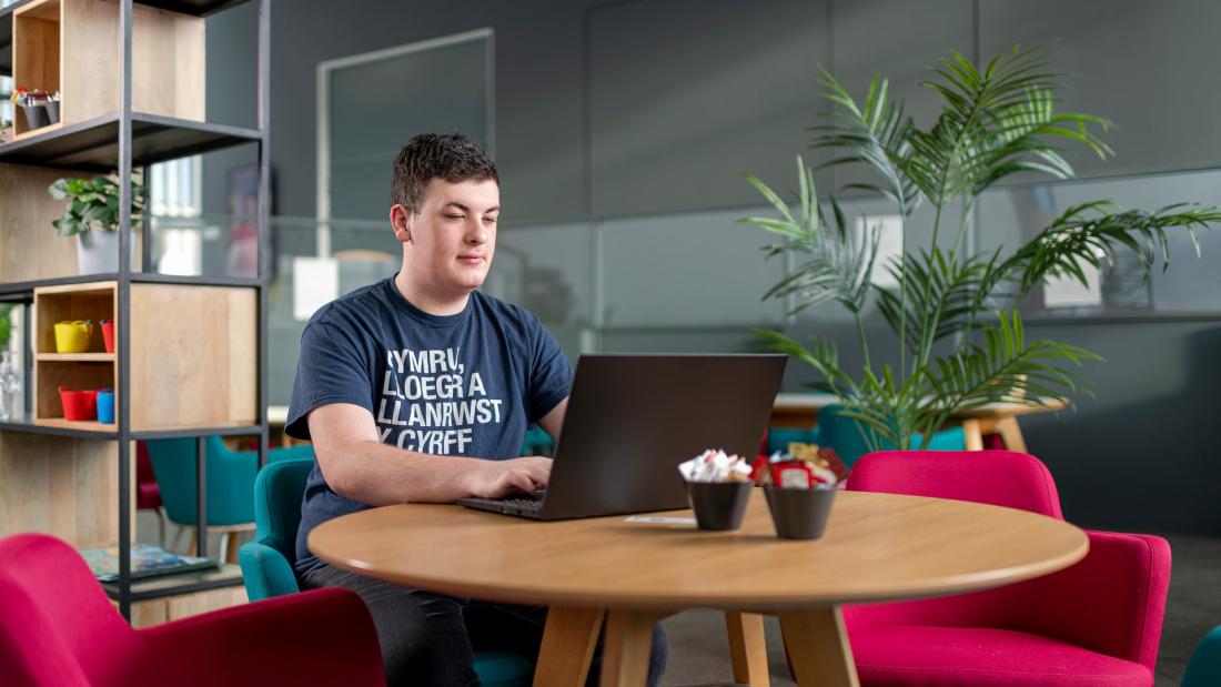 student wearing welsh t shirt