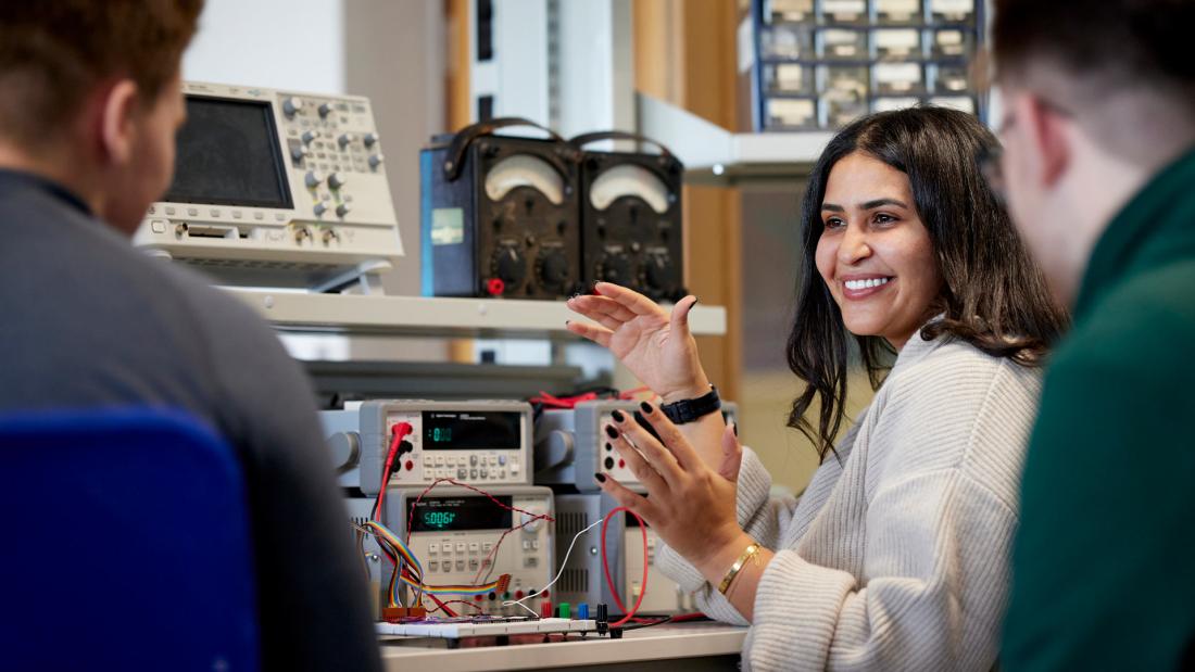 Electronic Engineering Students working with electronic equipment in a lab
