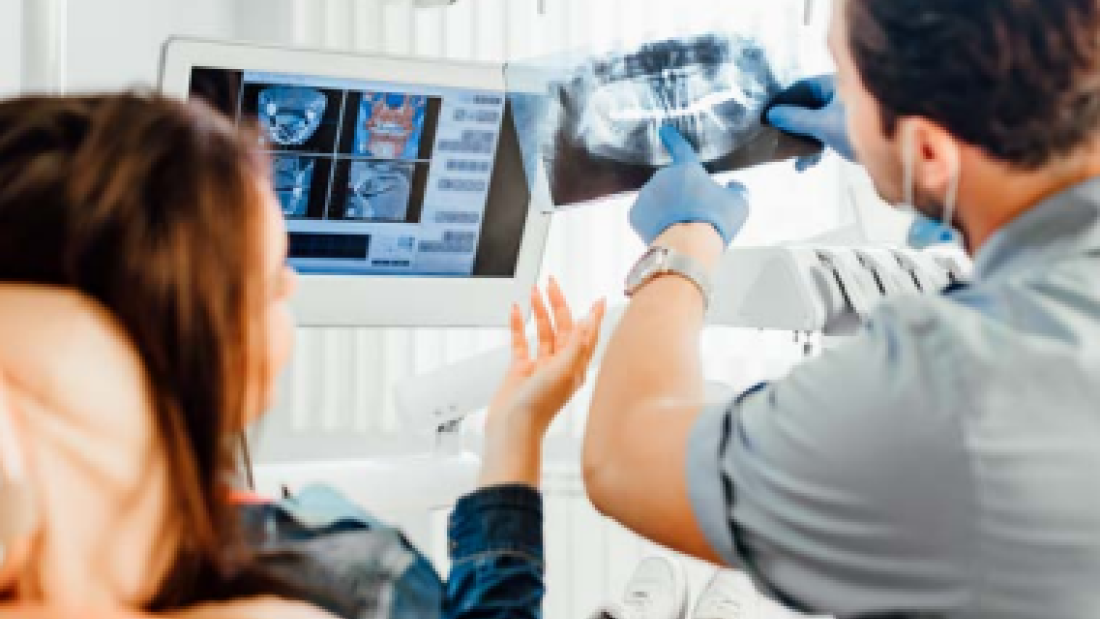 Doctor showing patient scans
