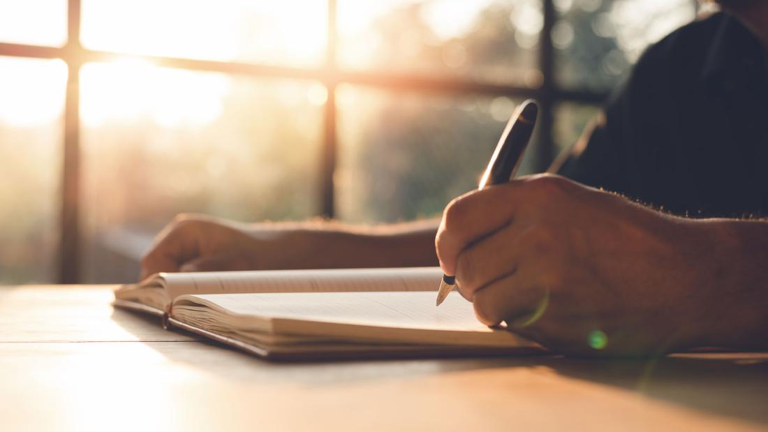 Student writing in Notepad