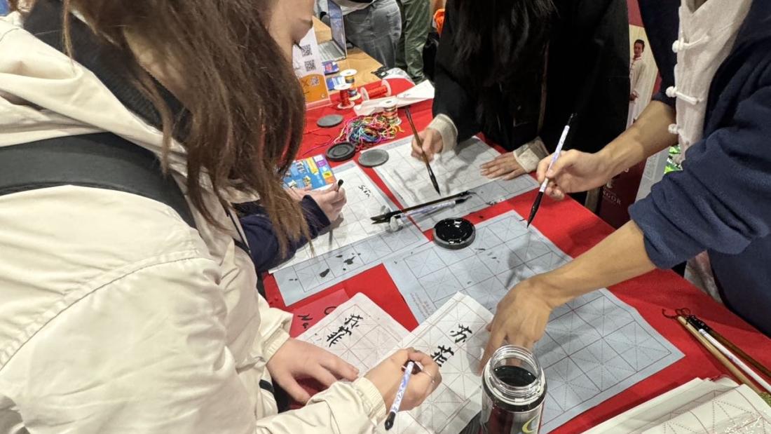 Students trying calligraphy