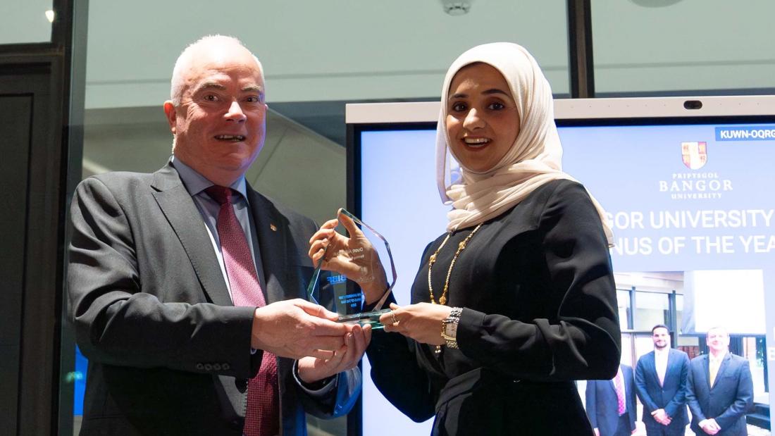 Prof. Andrew Edwards presenting an award to Duaa AlMasqati