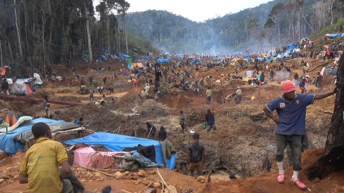 People on an open mine in a forest in Madagascar.