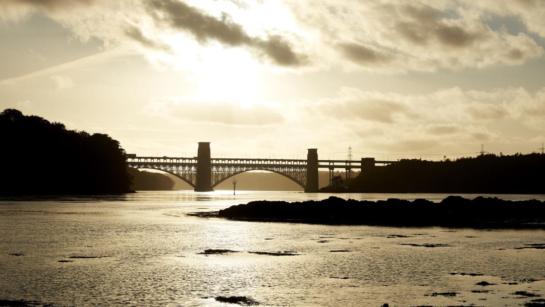 image of Britania Bridge with a sunset in the distance