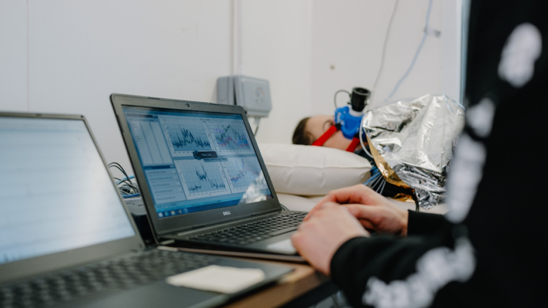 Researcher Sam Leaney testing the effectiveness of common and improvised prehospital methods to reduce cold stress in the environmental chambers of the Institute for Applied Human Physiology, School of Psychology and Sport Science, Bangor University.
