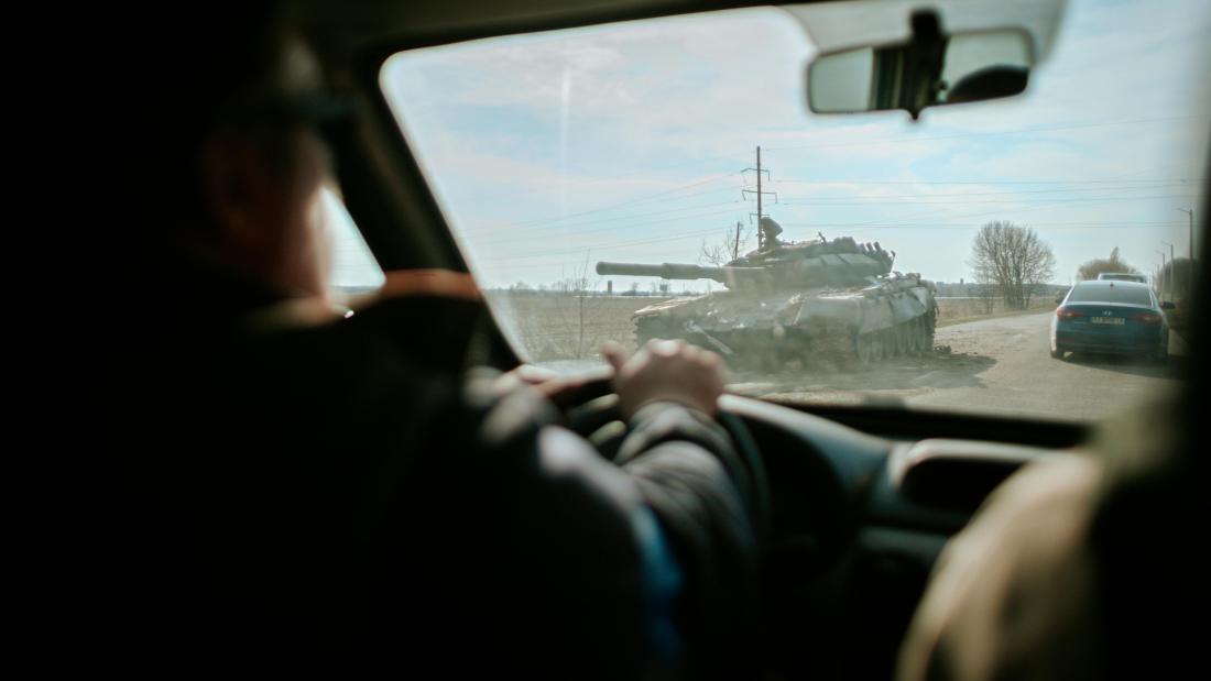 Image taken from a car of a war tank
