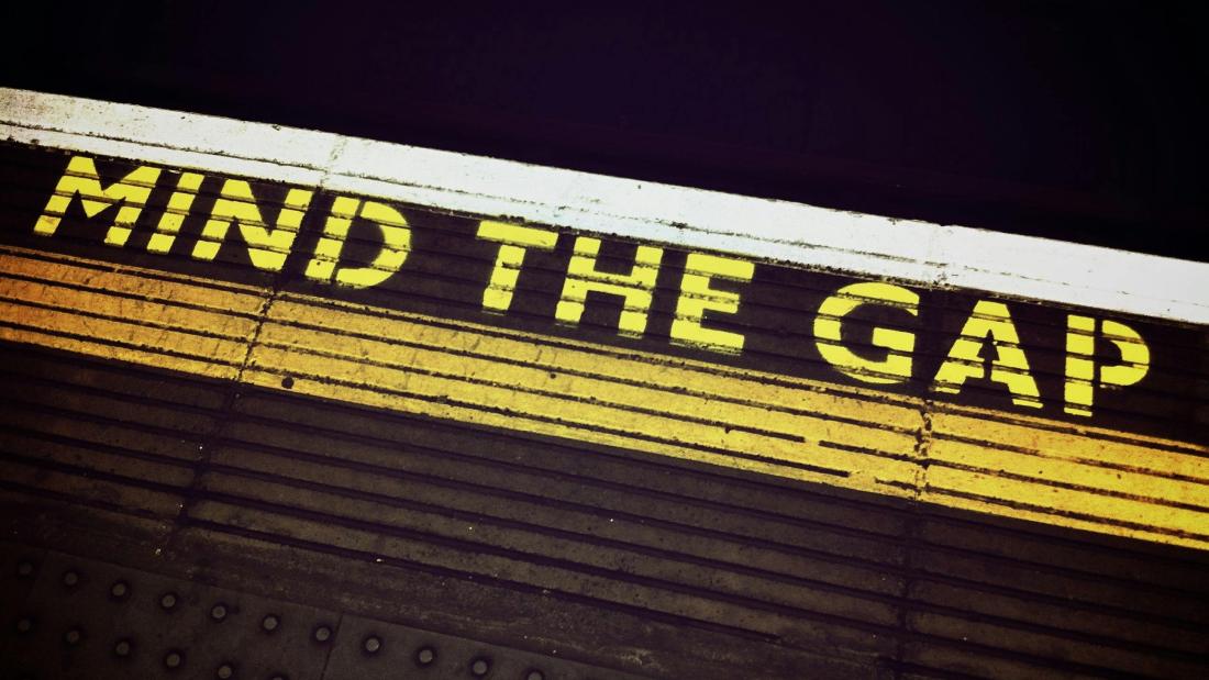 Mind the Gap waring on a platfrom edge