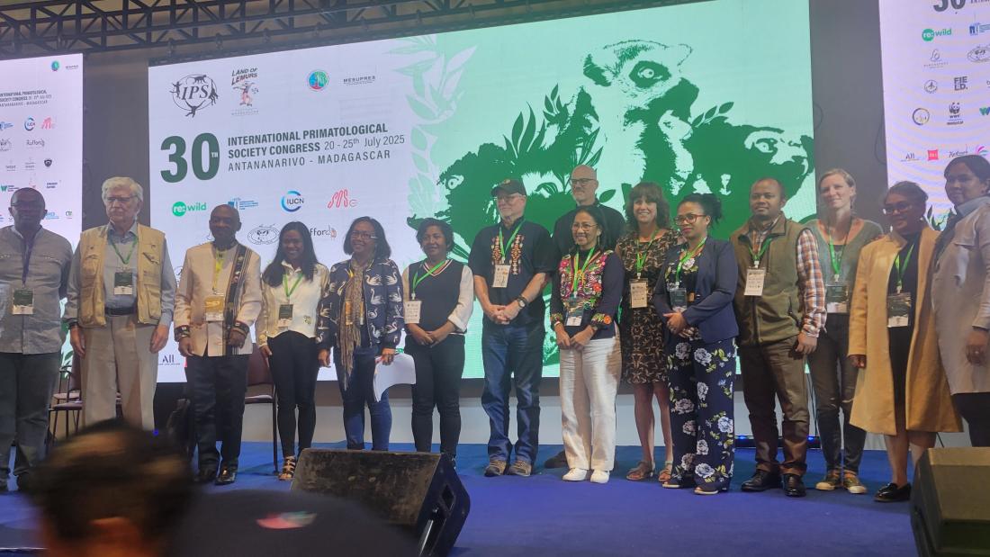Photo of symposium attendees on stage