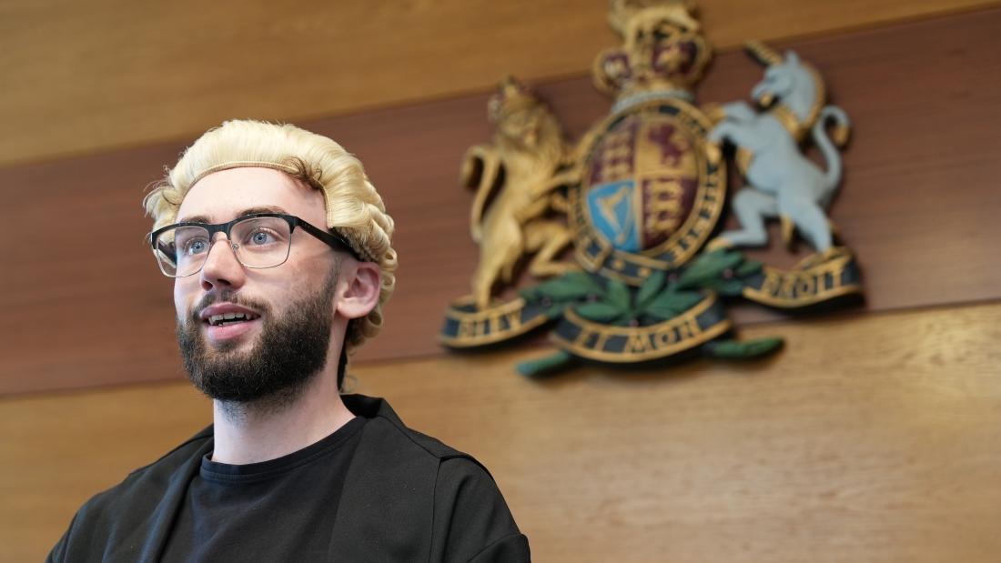 Law student practicing Mooting in the Moot Court at Bangor University