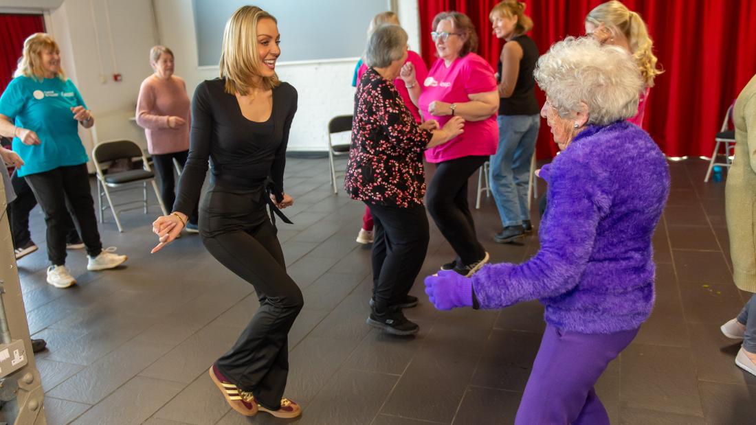 Professional Dancer Amy Dowden, Dance to Health Teacher Emma Jenkins and class participants.