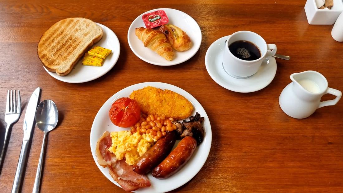 Breakfast served on the table with a cup of coffee and milk at The Management Centre