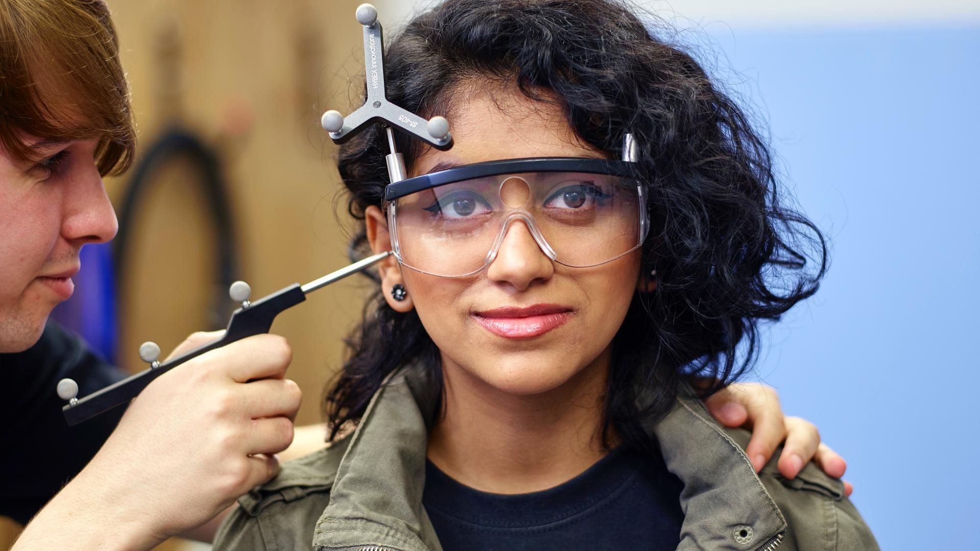 Students carrying out an experiment in the Transcranial Magnetic Stimulation laboratory