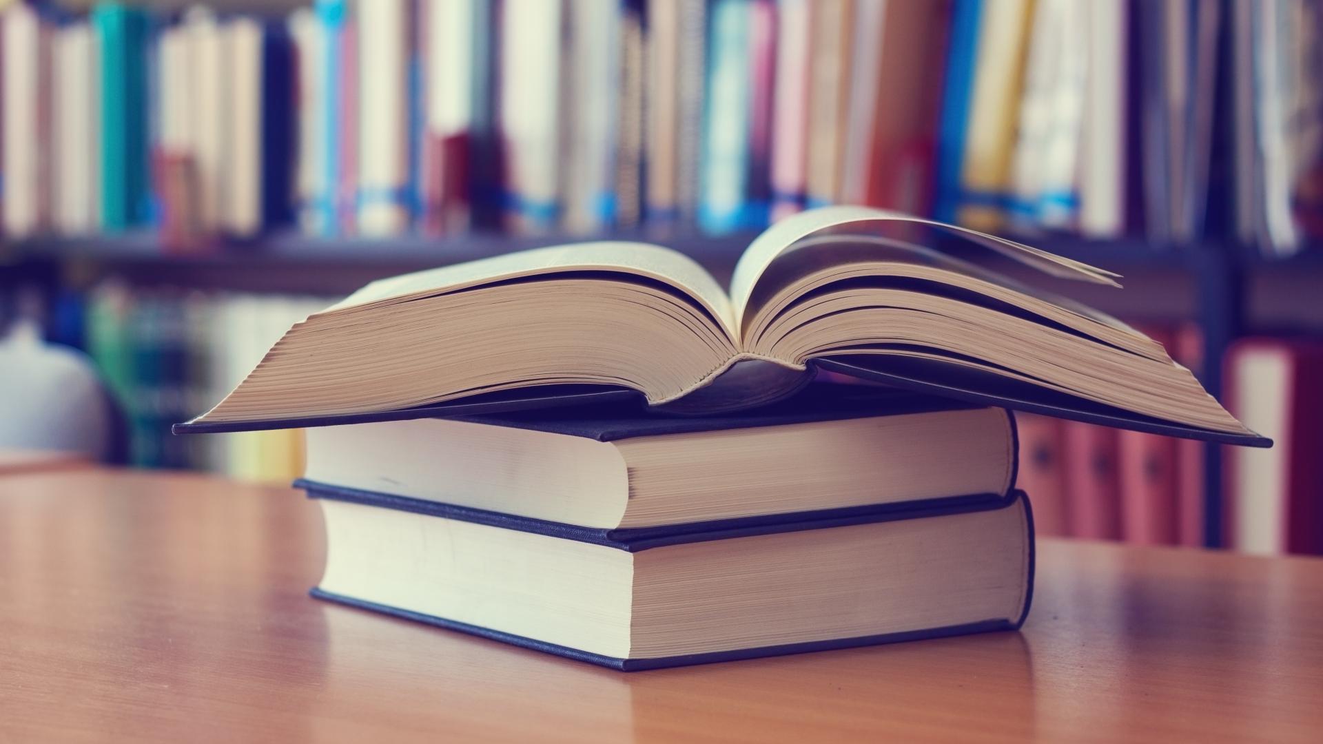 Open book on a table in a library