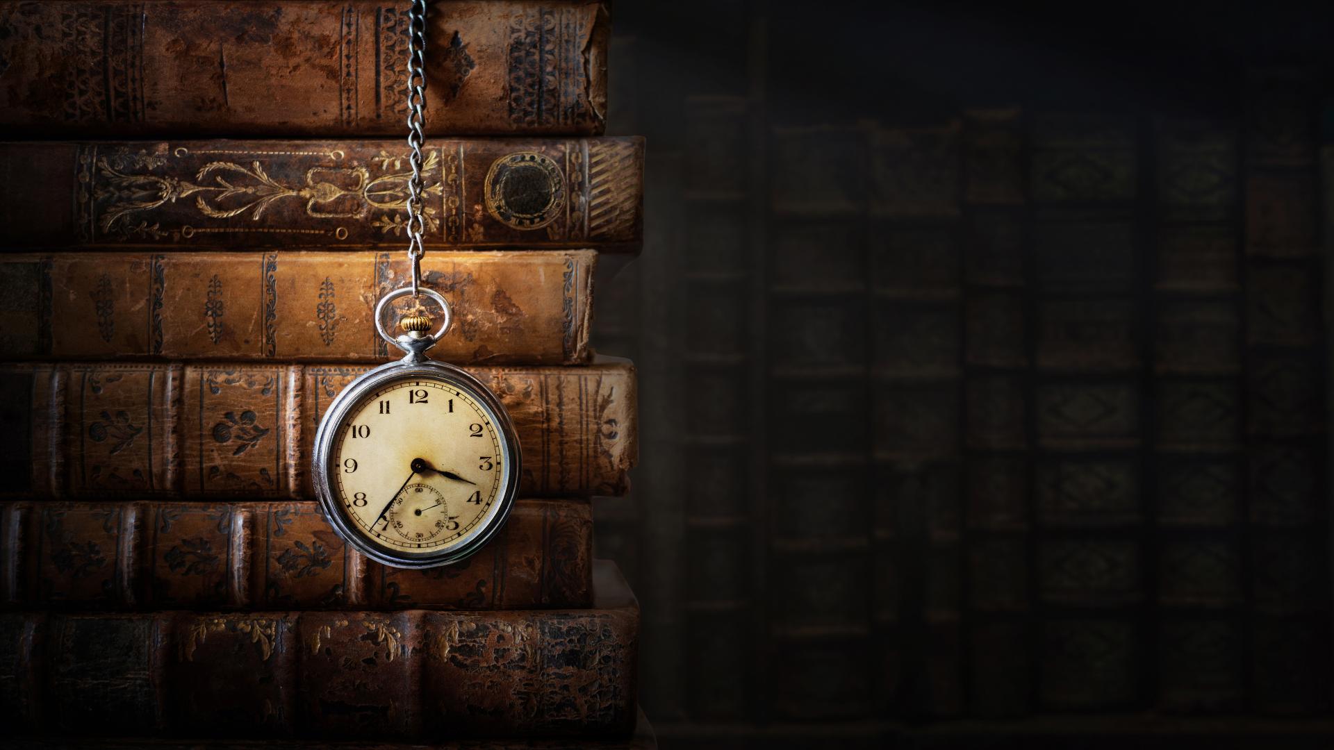 Clock face with history books 