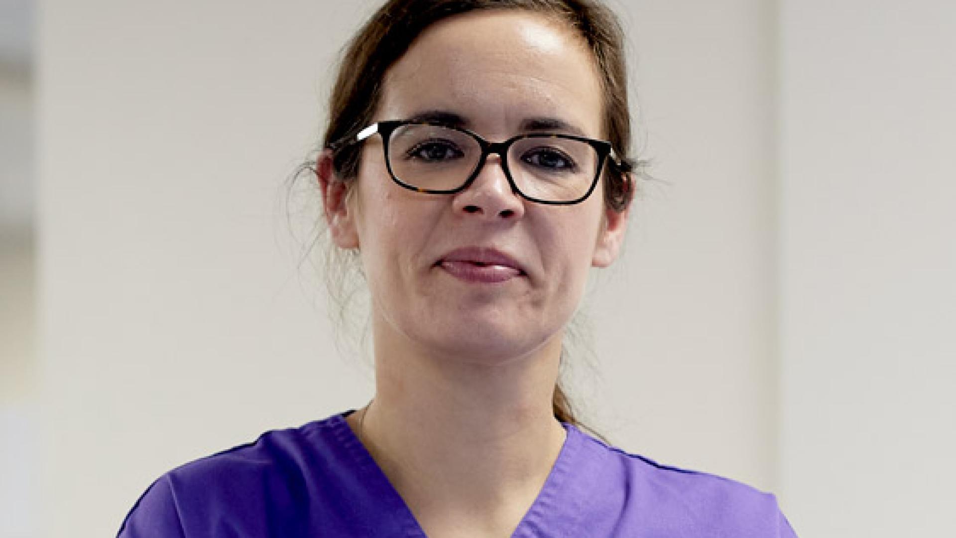 Adult Nursing student wearing a Bangor University Apron