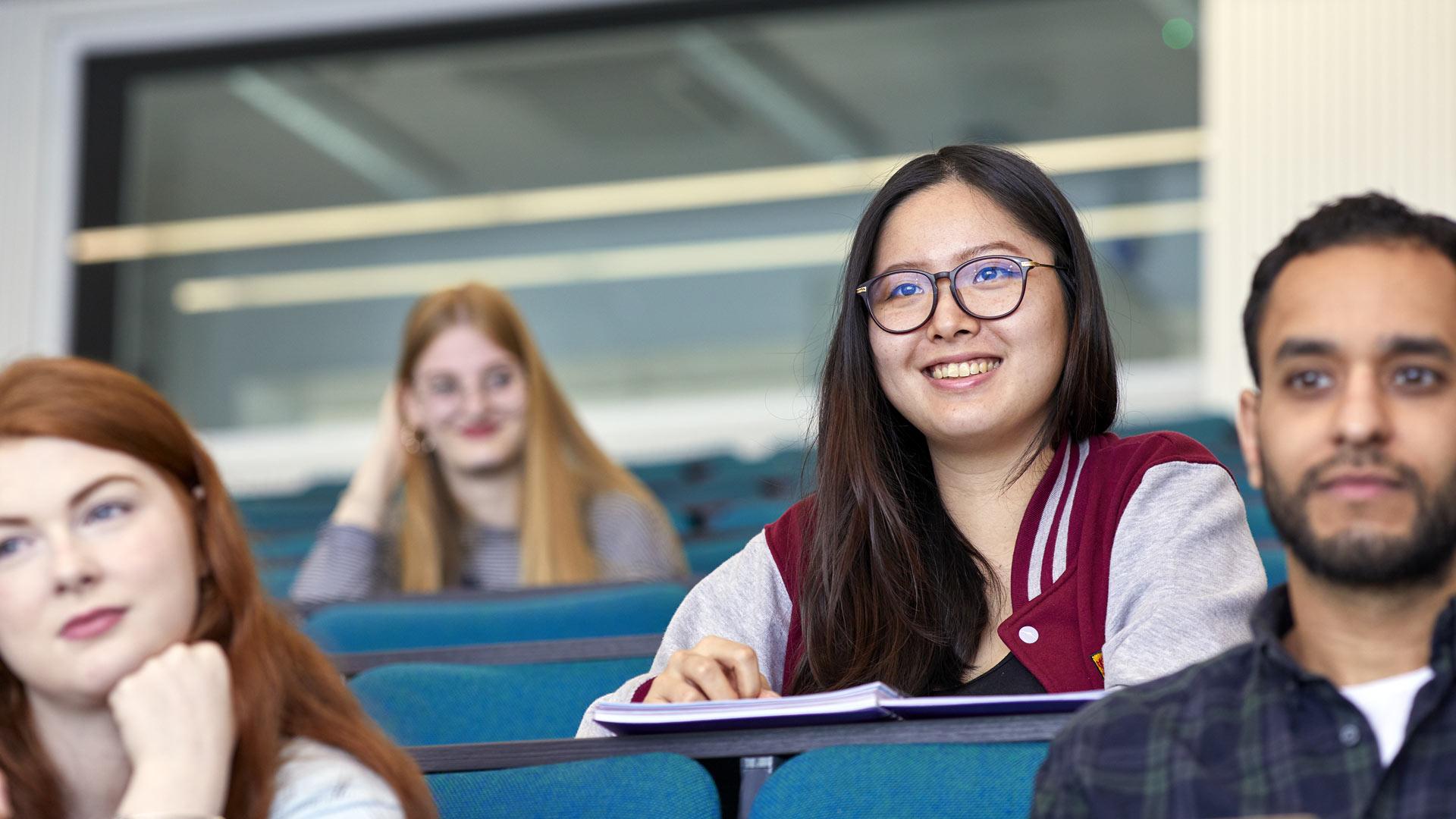 Female student smiling during a lecture