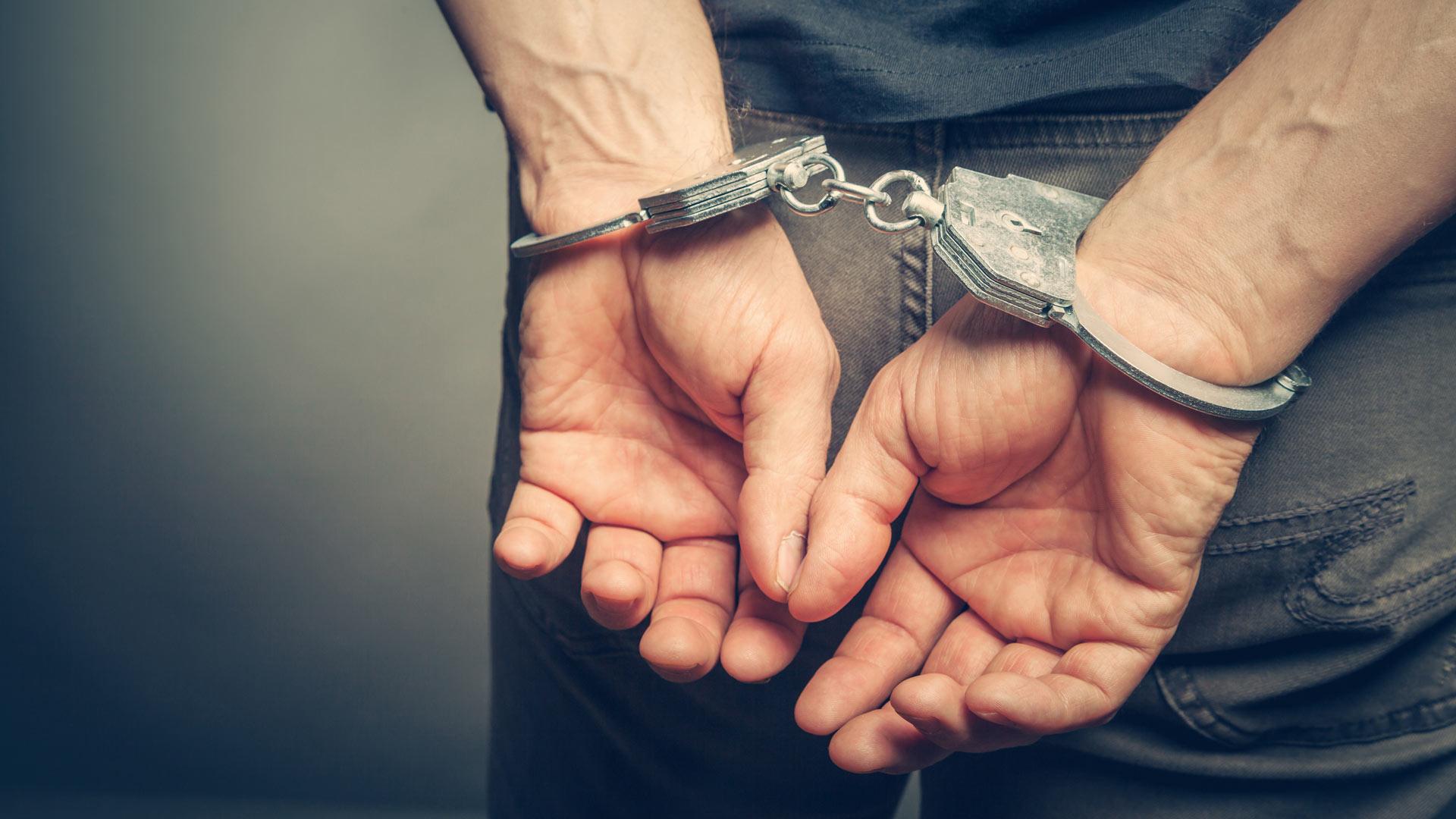criminal in handcuffs