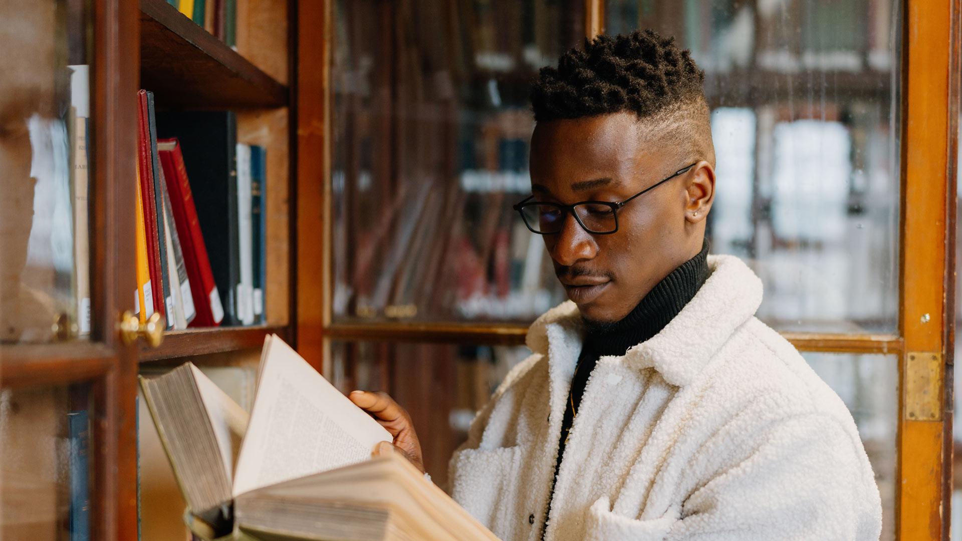 student in library