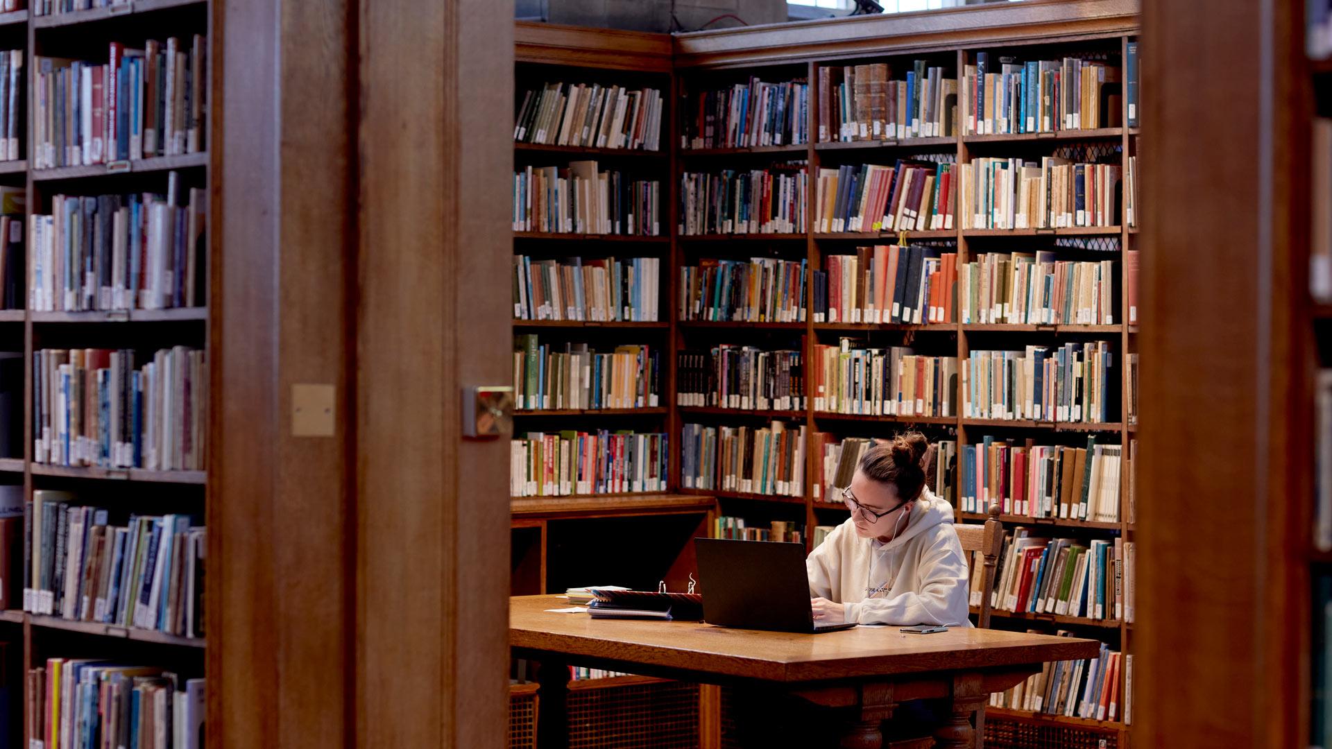 girl studying in university library