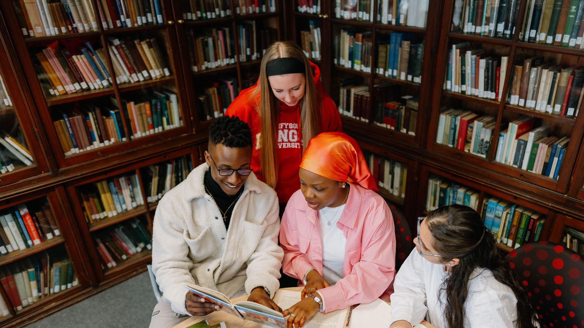 students studying history books in library