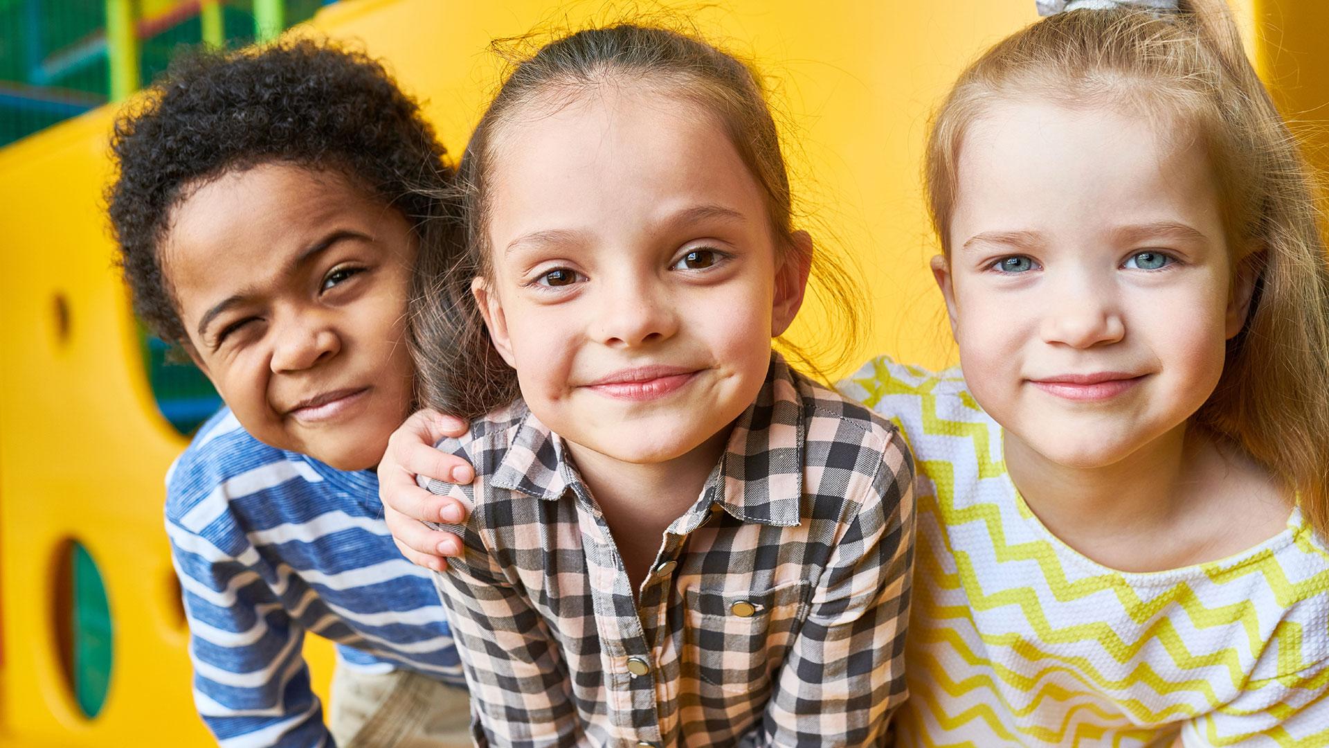 Group of primary school children smiling together