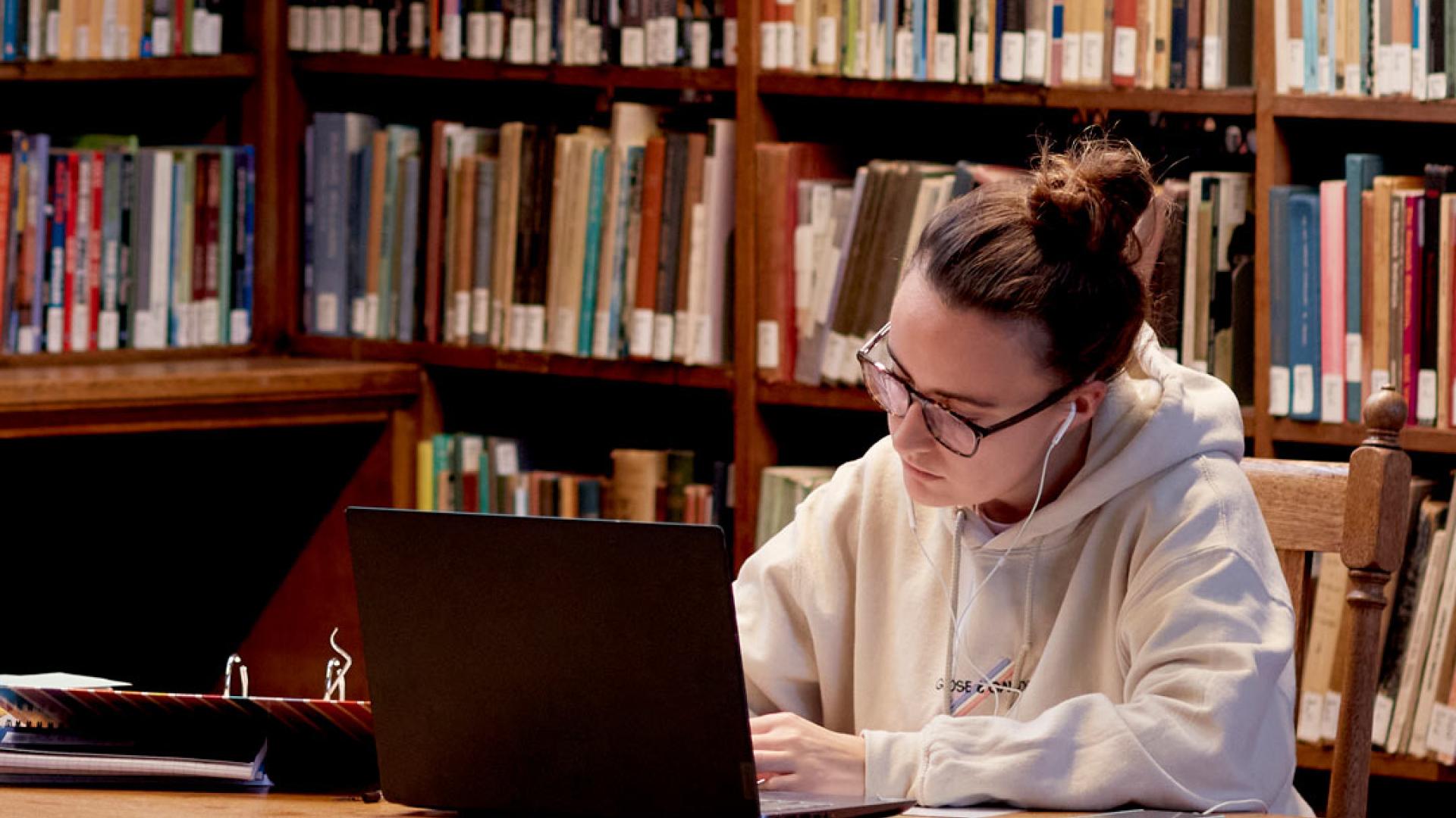 girl studying in university library