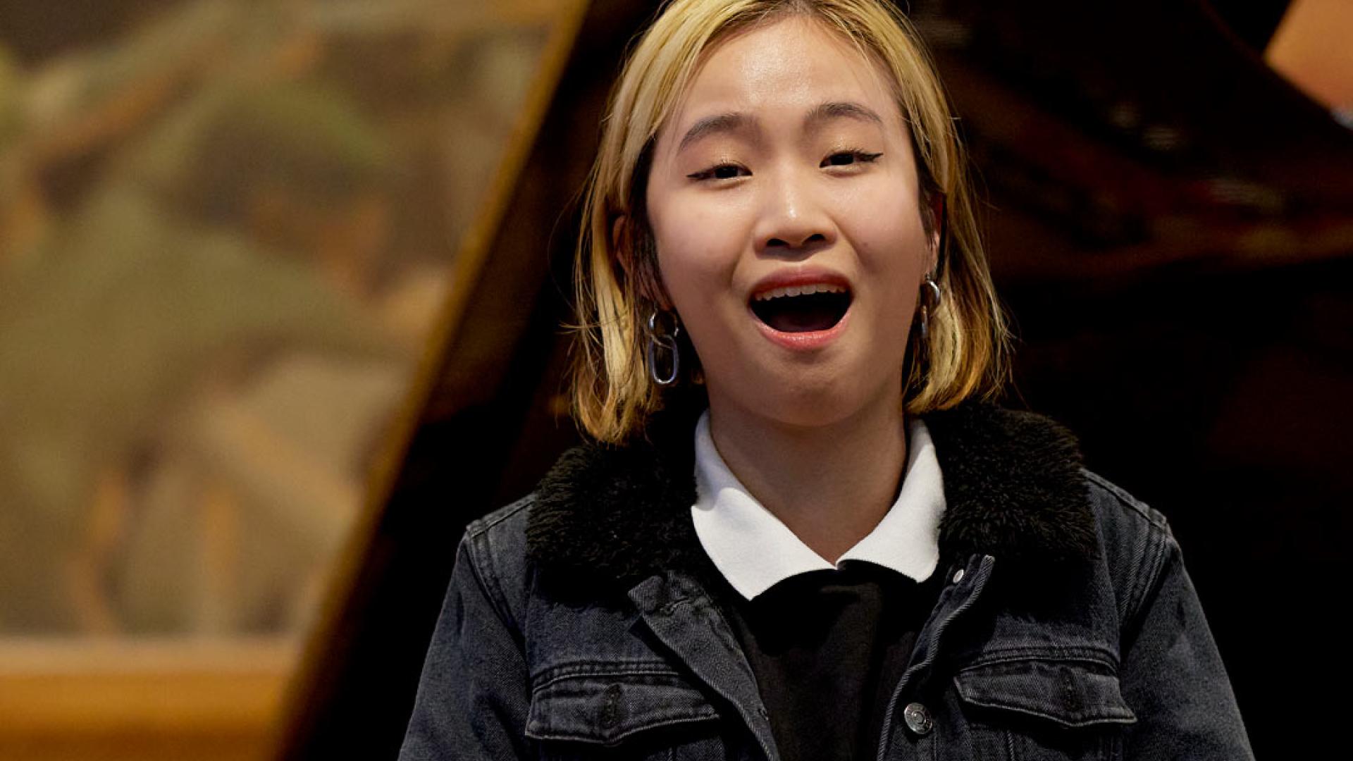 Female singer performing in front of pianist