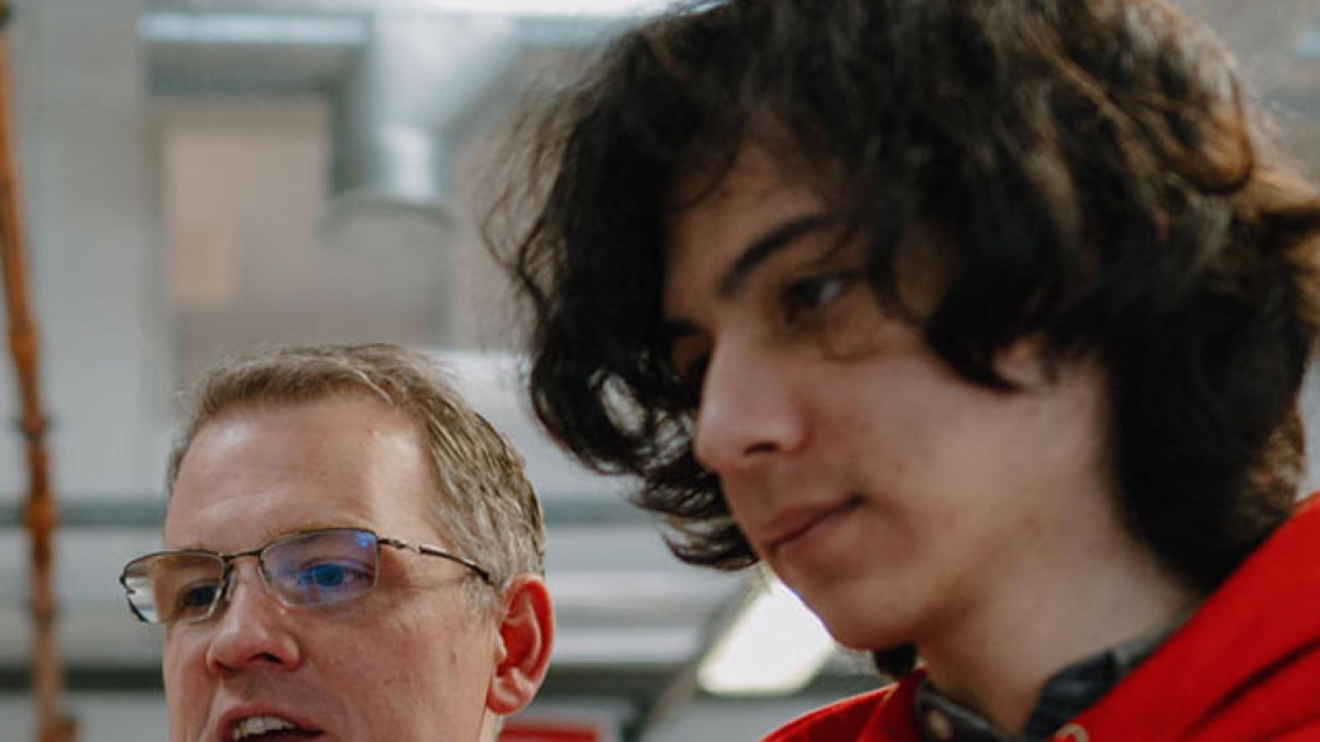 Engineering student with lecturer in a lab