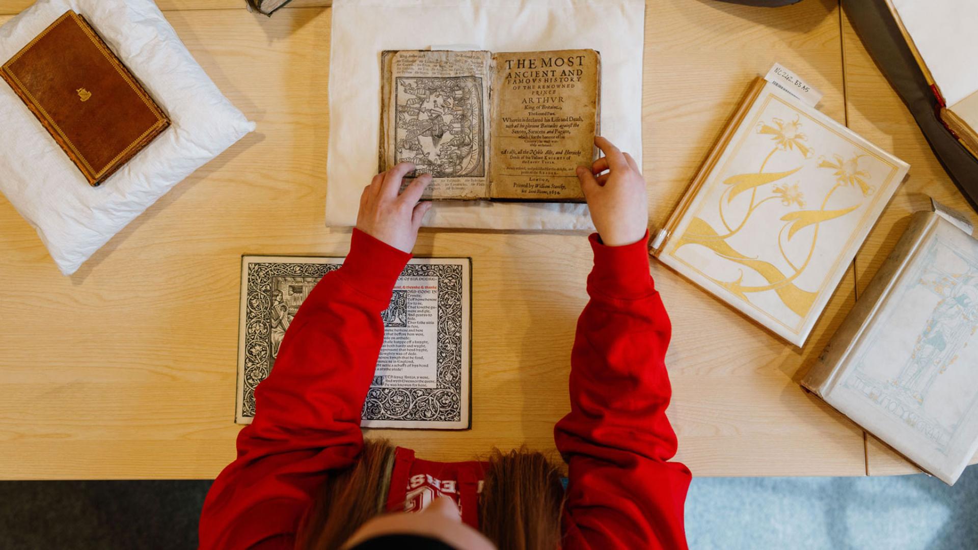 student studying historic texts