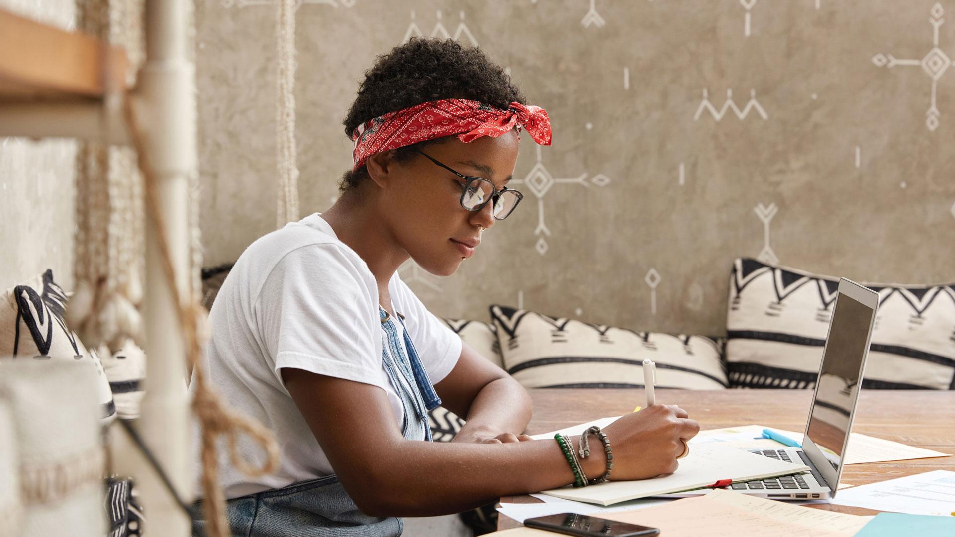 Girl writing in notebook