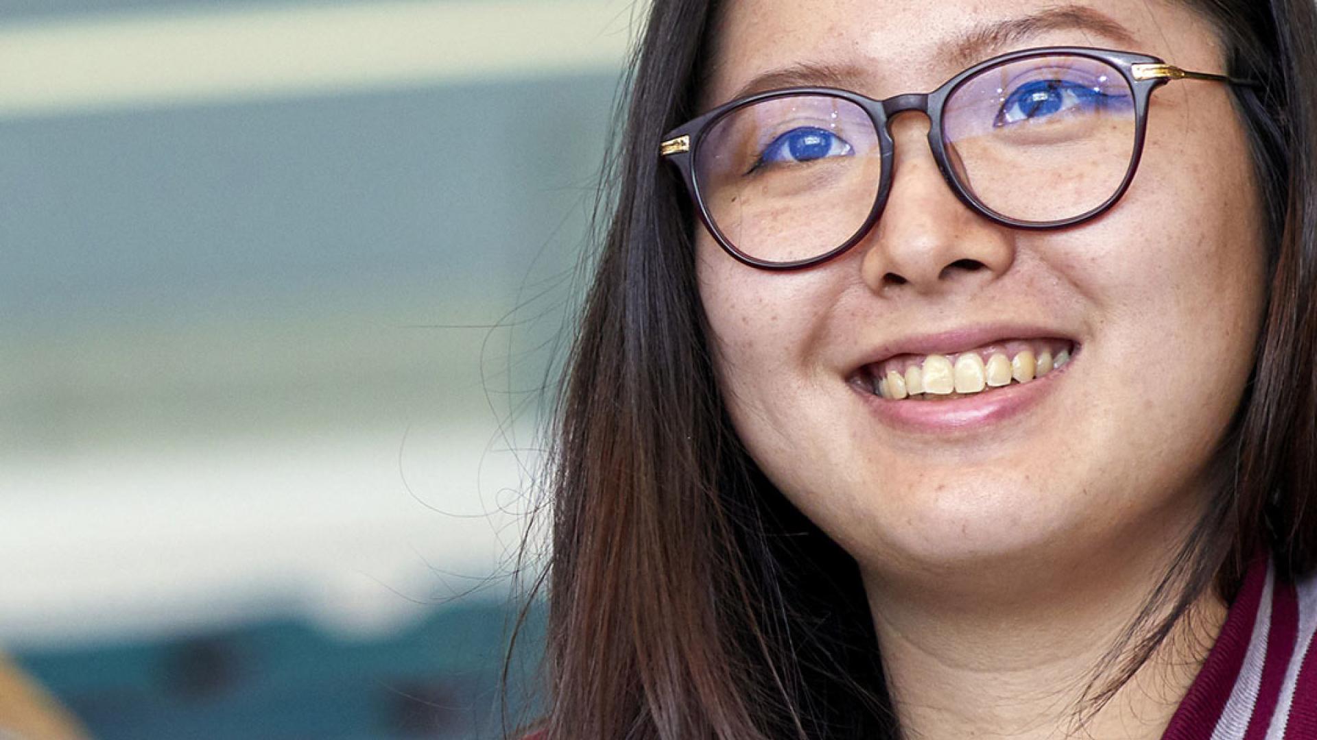 Female student smiling during a lecture
