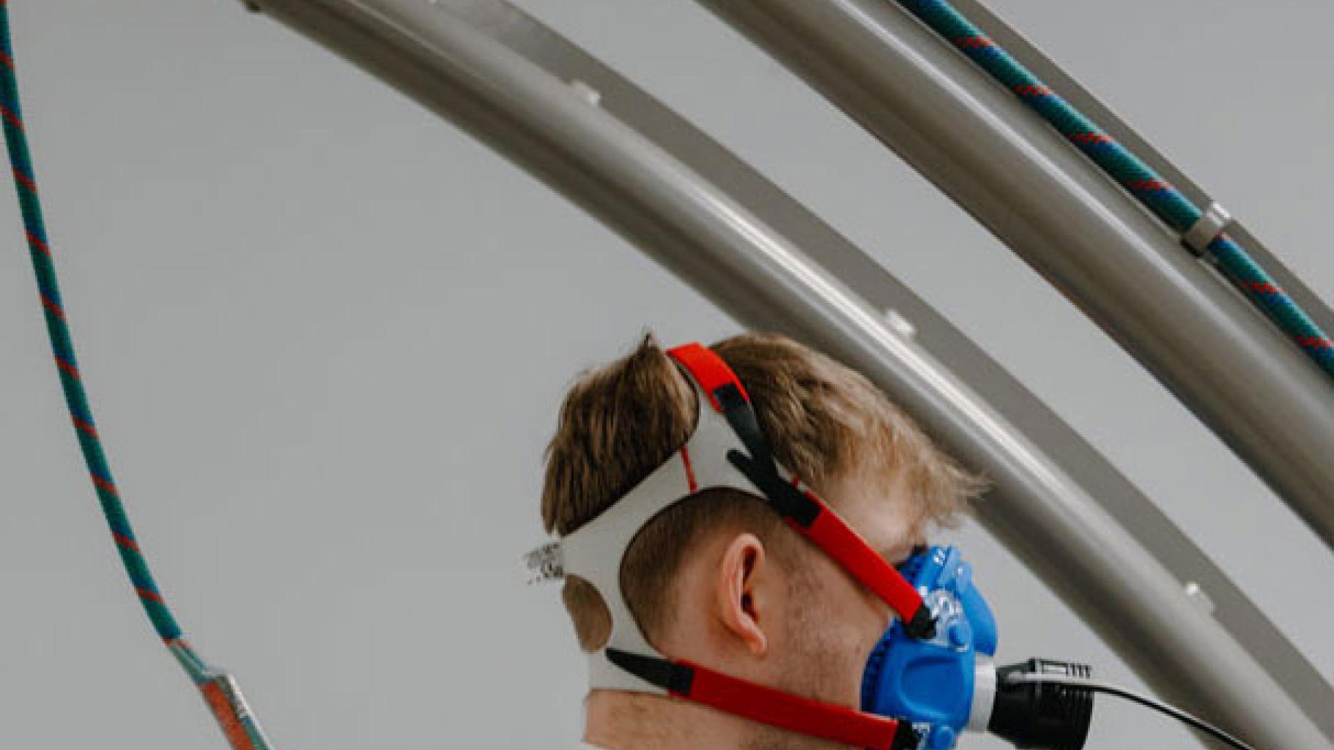 Sports Science student exercising while wearing breathing apparatus