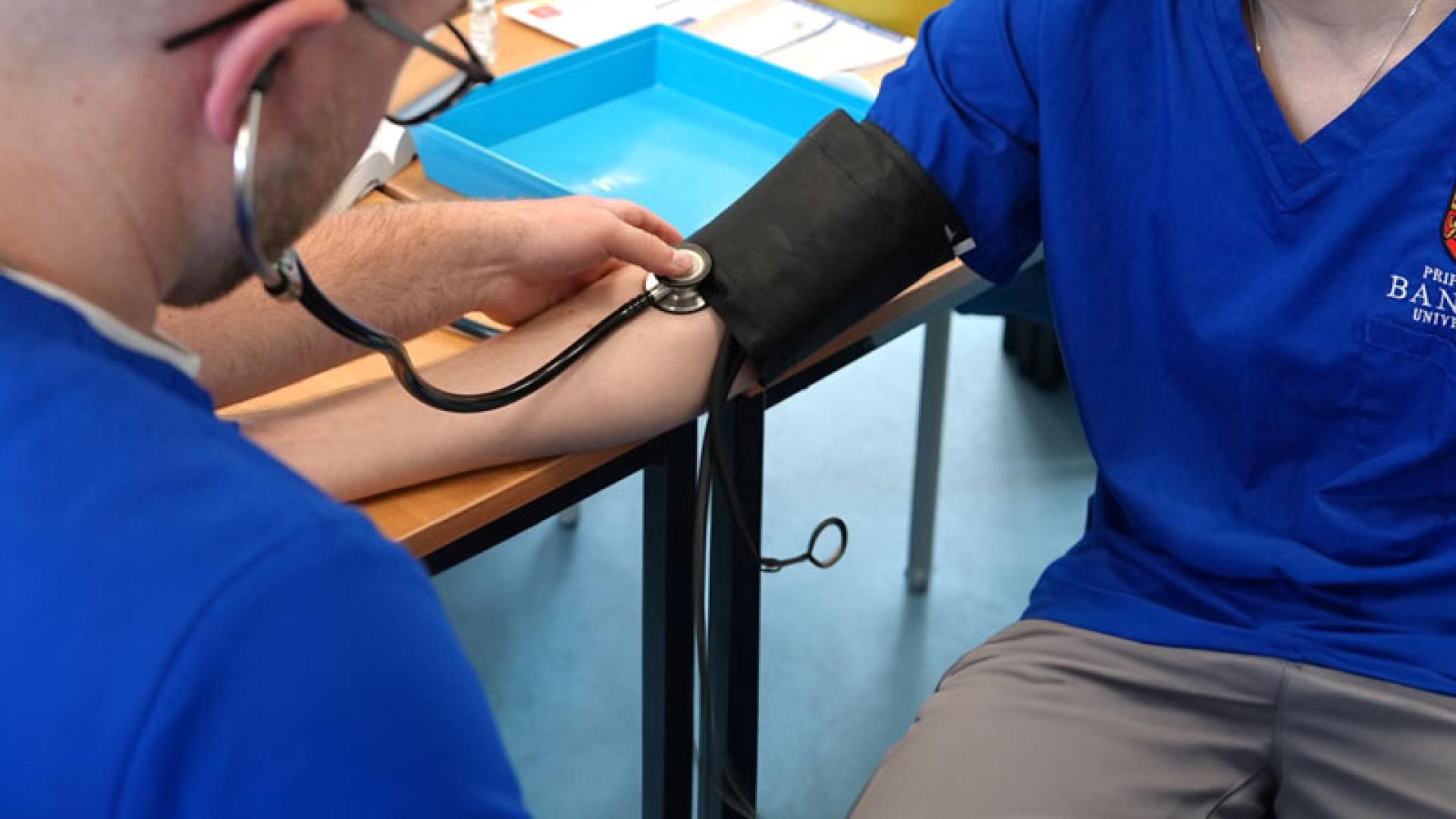 Student having blood pressure checked