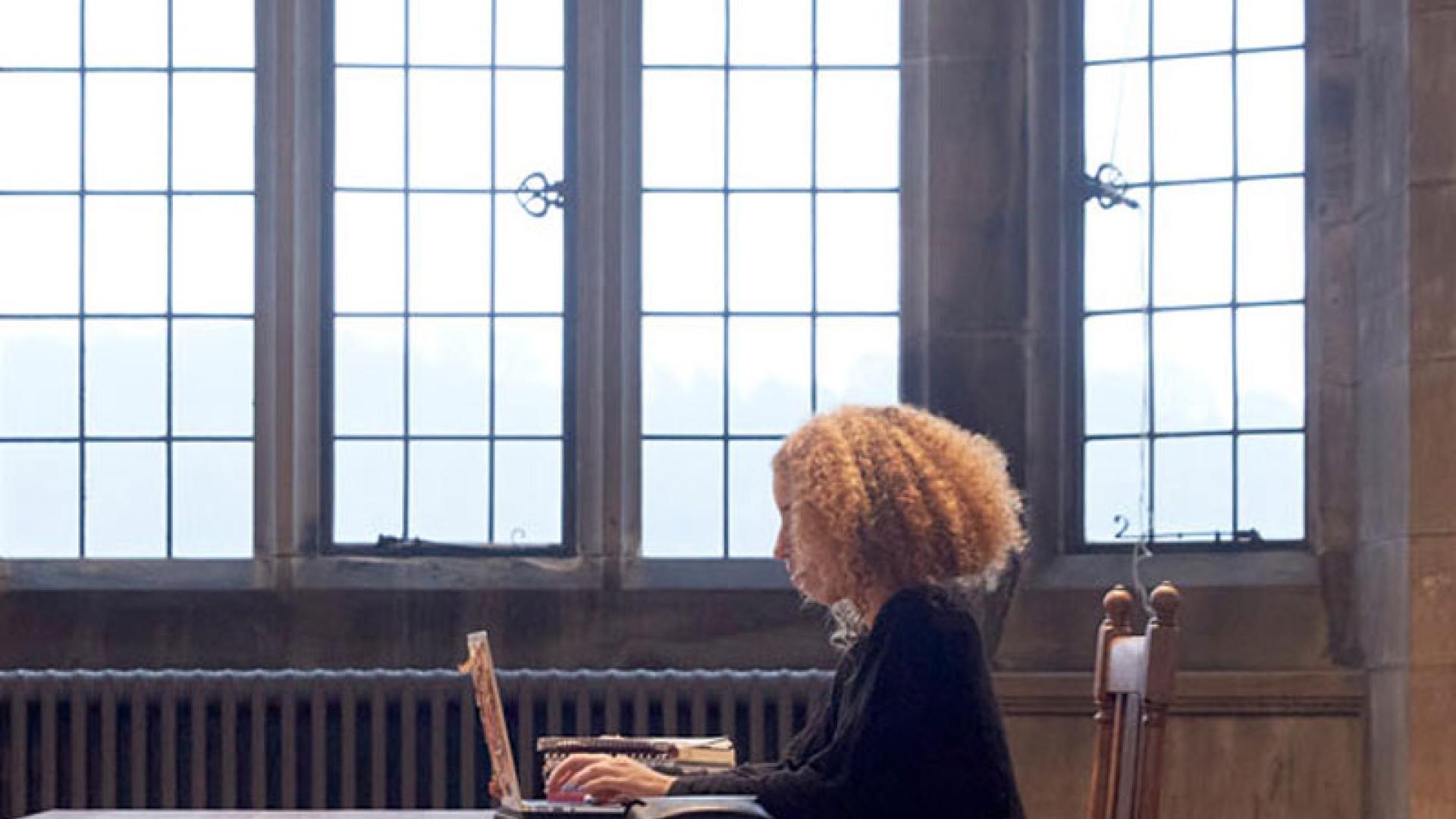 student studying in university library