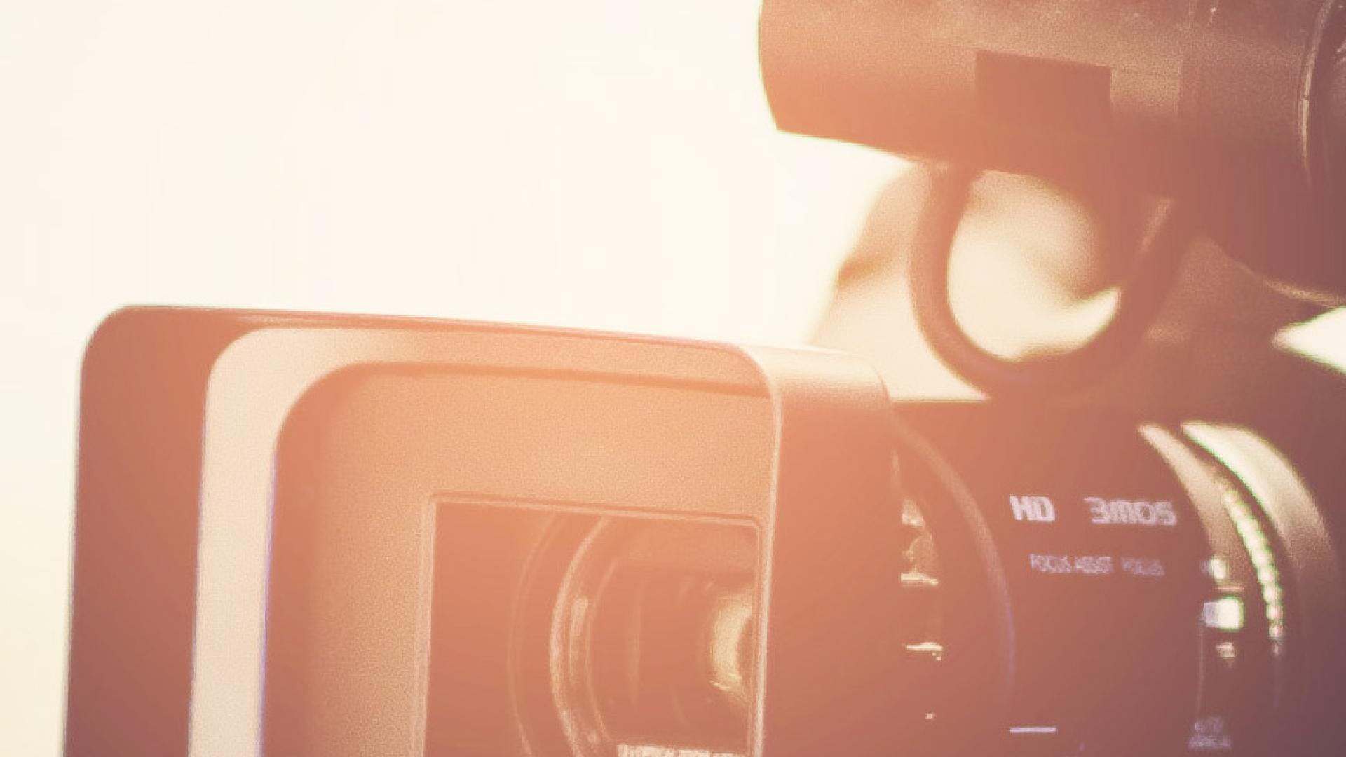 Person filming with a camera