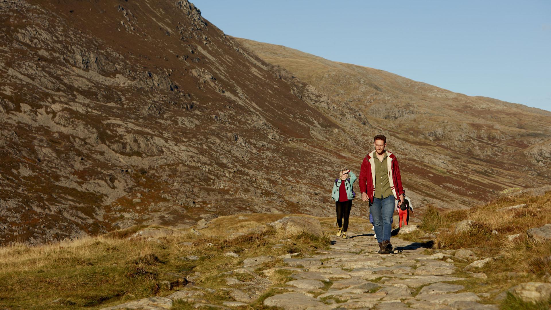 Students walking a stone path in Eryri