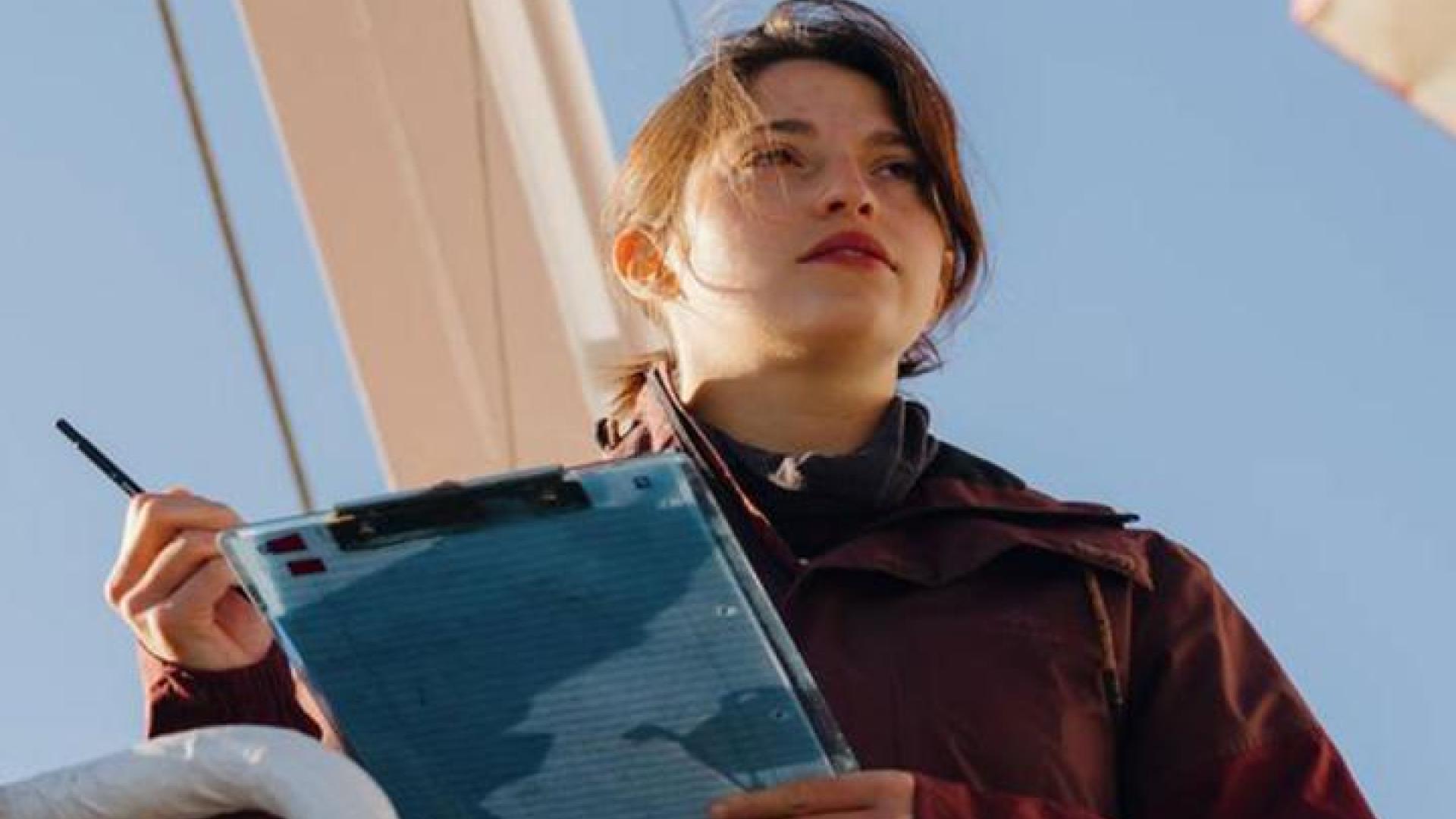 Student on a boat doing research