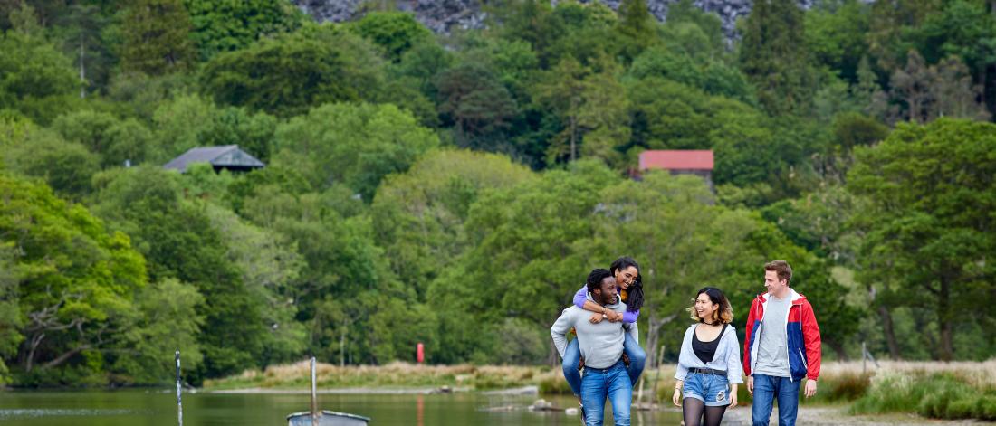 Students having fun by the lake in Llanberis