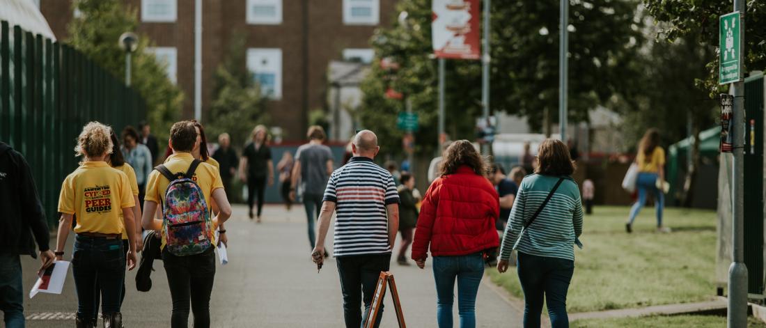 Peer Guides and new students walking through the Ffriddoedd Student Village during Welcome Week