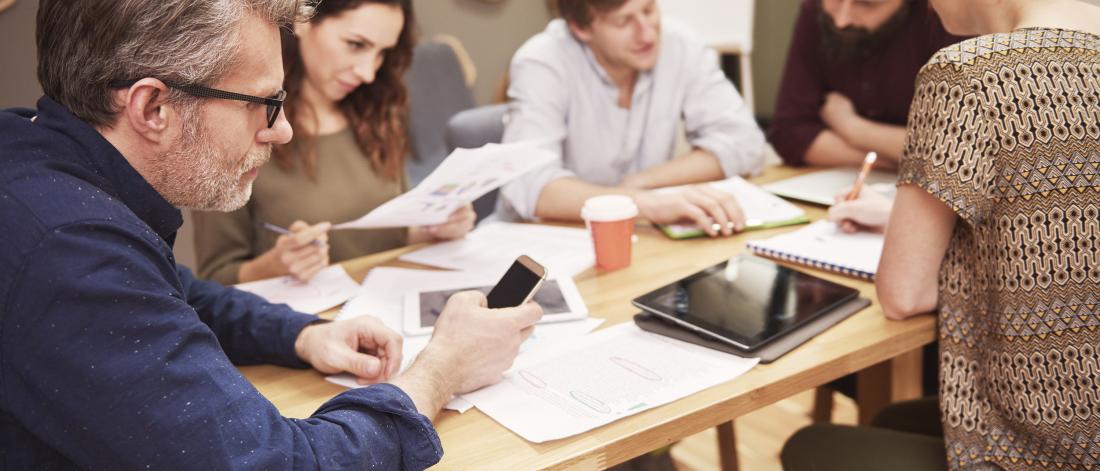 Group of students working together around a table