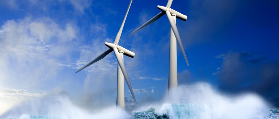 Wind turbines generating green energy at sea.