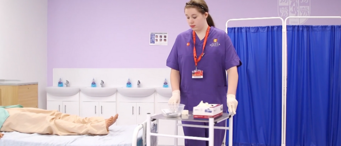 Student in a mock-up ward