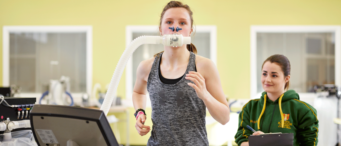 student female running in sport lab