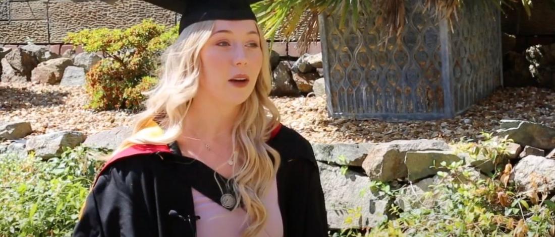 Video thumbnail of Fern Wilson wearing a cap and gown during Graduation day at Bangor University.