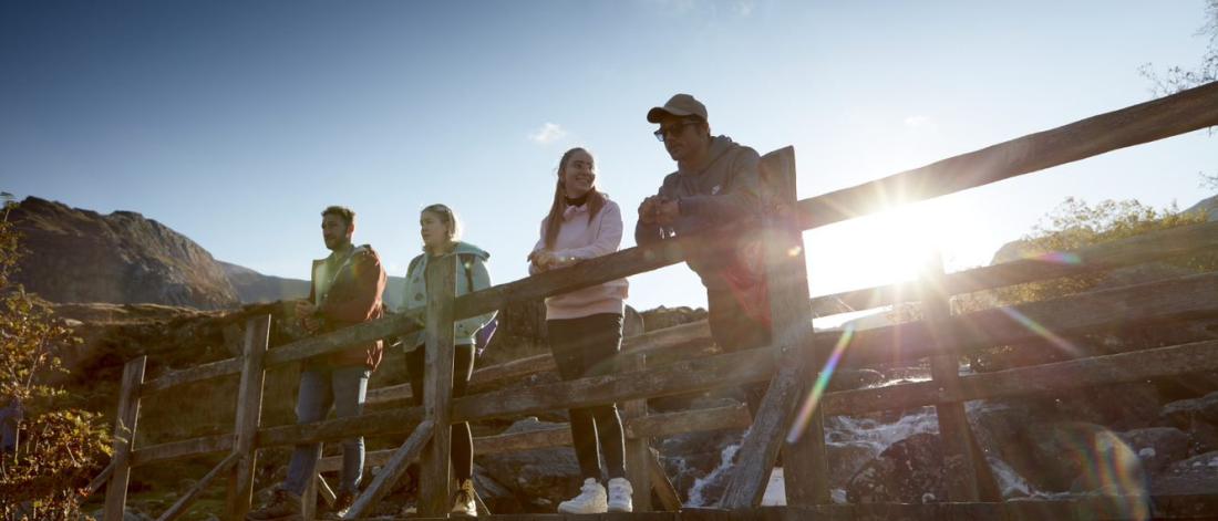 Students in Snowdonia standing on a footbridge
