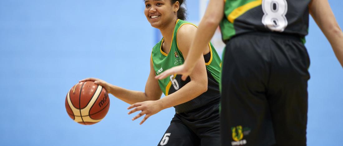 Student playing basketball