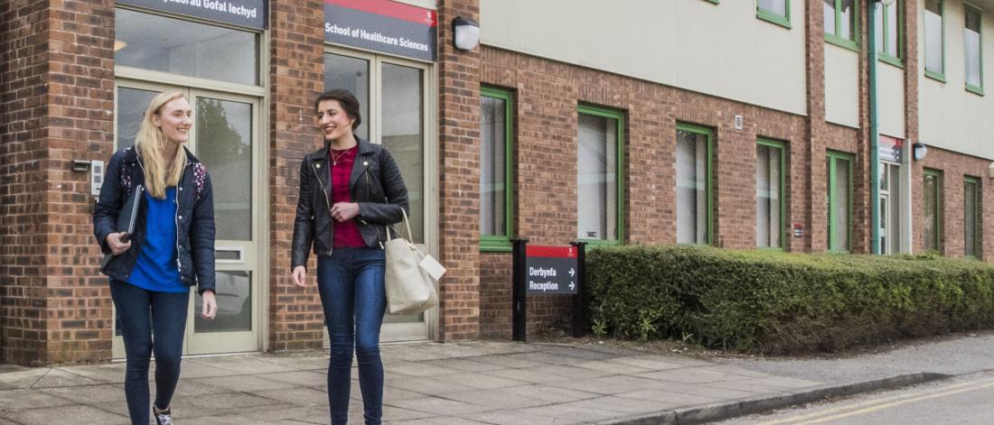 Students walking around Wrexham Campus