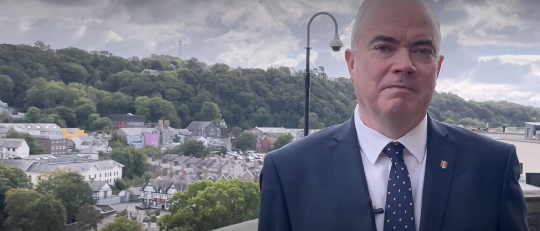 Professor Andrew Edwards with a view of Bangor behind him