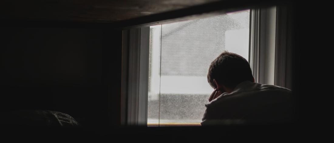 person looking down at window