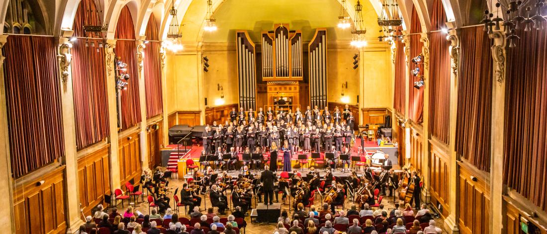 Concert hall with orchestra and audience